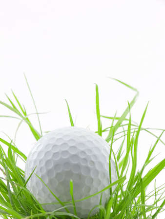 Golf ball in tall grass or ruff, isolated on whiteの写真素材