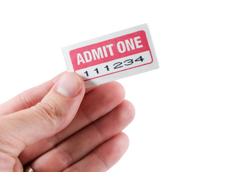 Hand holding an admit one ticket isolated on white