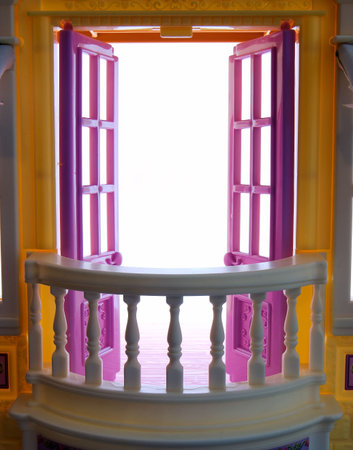 Open doors on a balcony with white space behindの写真素材