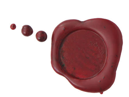 Red wax seal to close envelopes, letters, or contracts. Isolated on whiteの写真素材