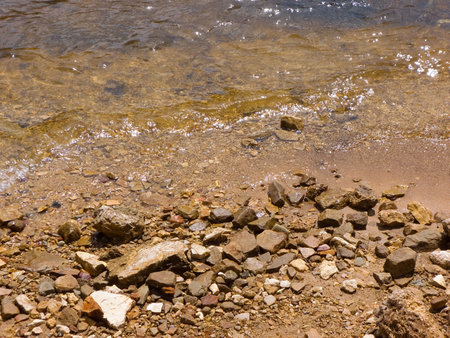 Waves coming up on a rocky beach