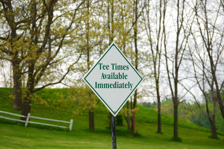 Sign posted that says "Tee times available immediatly" near a golf courseの写真素材