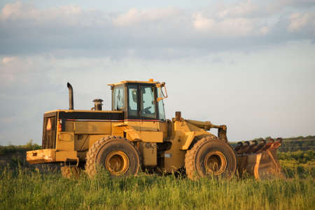 Front-end loader on a work site in rural Americaの写真素材