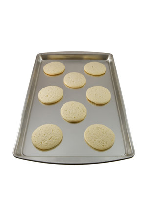 Sugar cookies freshly baked on a cookie sheet