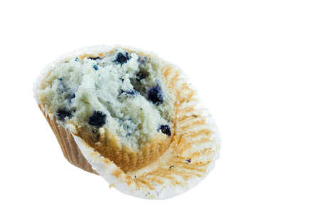 Partially eaten blueberry muffin isolated on whiteの写真素材
