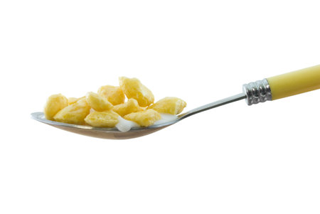 Spoonful of cereal and milk isolated on white
