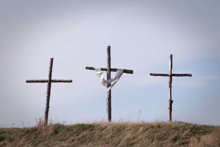 Three crosses on hilltop symbolizing the crucifixionの写真素材
