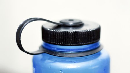 Closeup of blue water bottle screw-on lidの写真素材