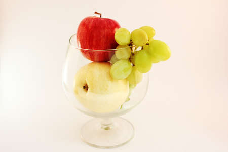 Fruit inside big drinking glassesの写真素材
