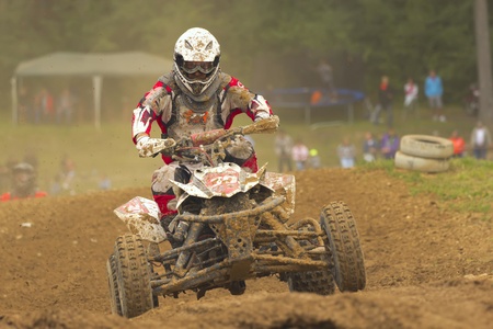 BELA U JEVICKA, CZECH REPUBLIC - JULY 23  Unidentified racer rides a quad motorbike in the  Cross racing Cup 2011  on July 23, 2011 near the town of Jevicko, Czech Republic  のeditorial素材