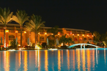 Night pool side of resort  trademarks were removed のeditorial素材