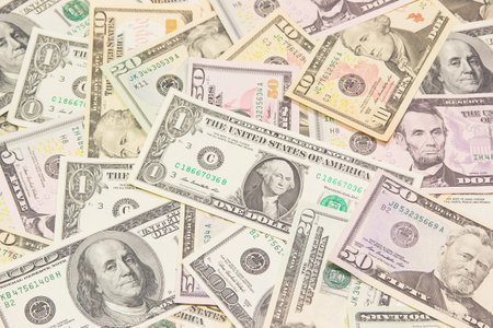 Background composed of U S  banknotes lying on the table 