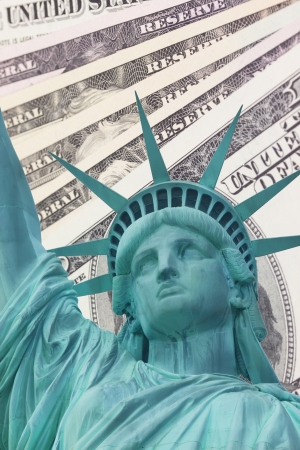 Detailed view of Statue of Liberty and background with money US dollar bills の写真素材