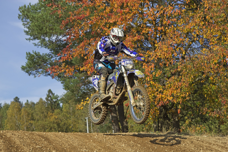 ZABREH, CZECH REPUBLIC - OCT 19.Motocross rider is jumping at Motocross Zabreh Cup on October 19, 2013 in Zabreh, Czech Republic (Central Europe)のeditorial素材