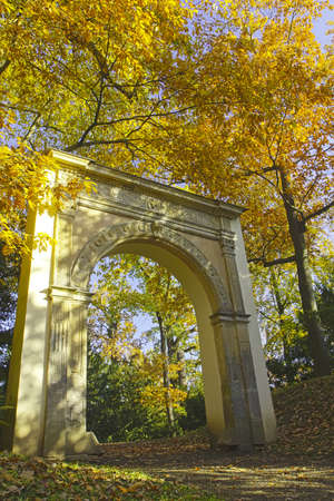 Close up view of unknown romantic gate at autumn park.の写真素材