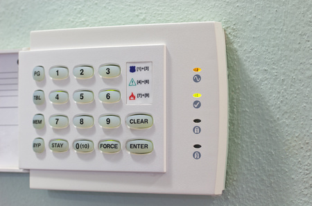 Security Appliances numeric keypad on the green wallの写真素材