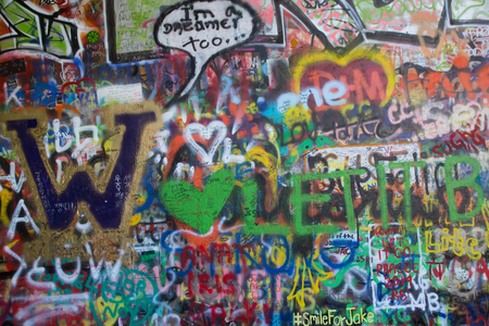 PRAGUE, CZECH REPUBLIC - June 09, 2014: The Lennon Wall since the 1980s is filled with John Lennon-inspired graffiti and pieces of lyrics from Beatles songs on June 09, 2014 in Prague, Czech Republicのeditorial素材