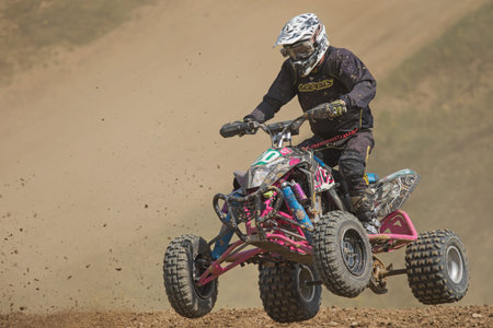 MOHELNICE, CZECH REPUBLIC - APRIL 25. Closeup of quad rider in a jump in the International...