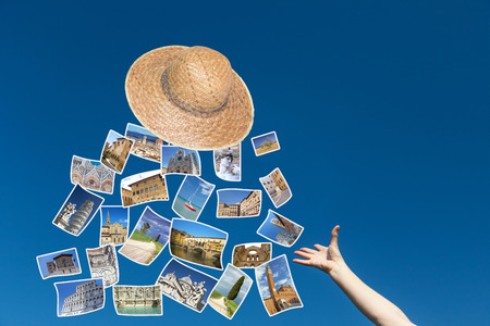 The female hand is throwing a straw hat, from which fly the photos of Tuscany sights.  Blue sky is in the background.の写真素材