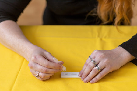 Closeup view of one of the steps of preventive rapid control    by a self-testing kit at home...