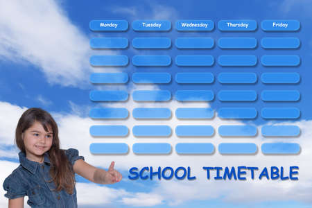 School timetable concept with blue sky in the background. Smiling tanned young girl is pointing at a planner.の写真素材