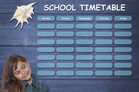 School planner concept on a marine theme. Little tanned girl is smiling on timetable.の写真素材