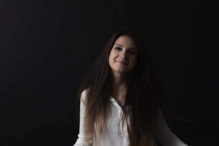 Portrait of smiling long haired girl. Horizontally.