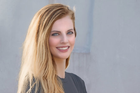 Portrait of smiling attractive young girl closeup. Horizontally.の写真素材