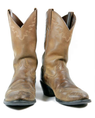 Old Leather Cowboy Boots Isolated on Whiteの写真素材