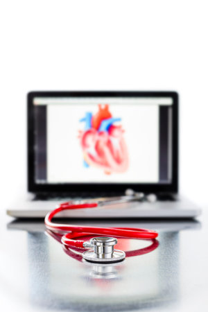 a stethoscope and laptop computer