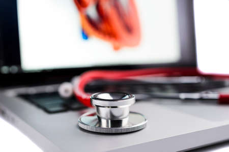 a stethoscope and laptop computerの写真素材