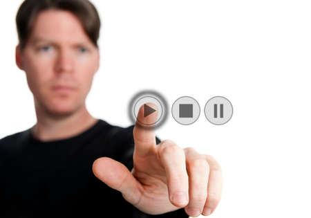 a man pressing a digital buttonの写真素材