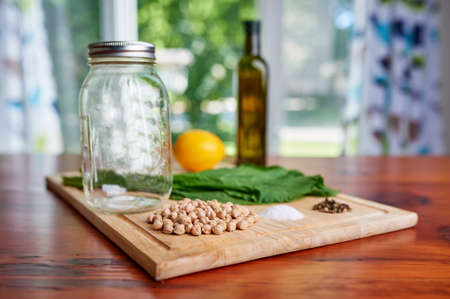 canning vegetables on a kitchen tableの写真素材