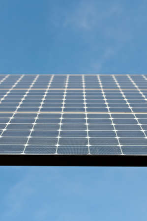 Closeup of a Photovoltaic Solar Panel with Blue Skyの写真素材