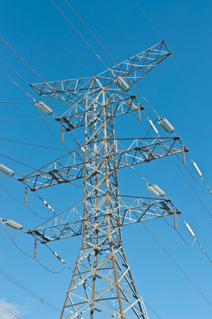 An electrical transmission tower carrying high voltage lines.