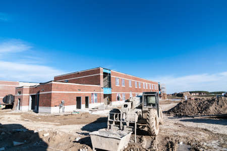 A new elementary school under construction in a suburban neighborhood.のeditorial素材