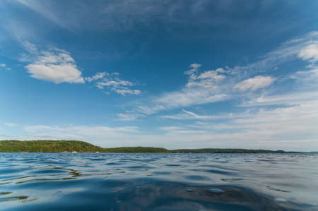 A Canadian lake in the Muskoka region of Ontario in the summertime.の写真素材