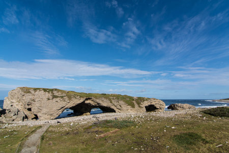 The natural stone arches at The Arches Provincial park in Newfoundland and Labrador, Canadaの写真素材