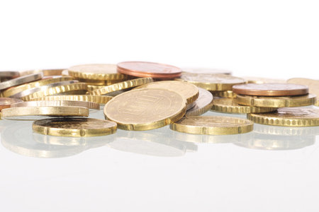 Picture of coins in a pile, white isolated background