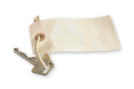 Picture of a key with a tag on  You can add your own text on the tagの写真素材