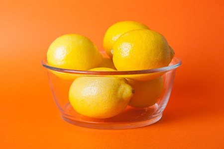 Citrus, orange, lime, lemon fruits on a coloured backgroundの写真素材