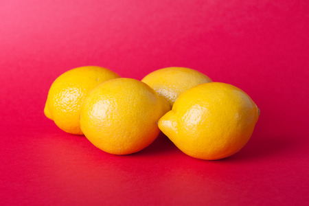 Citrus, orange, lime, lemon fruits on a coloured backgroundの写真素材