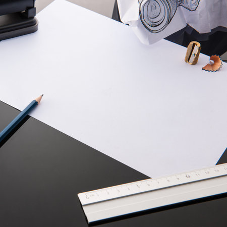 Office supplies and a piece of white paper where you can write your own text, stock picture