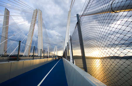 Tarrytown, NY / USA - 7/1/20: sunset view of The Path on the Governor Mario M. Cuomo Bridge. A 12-foot wide path located on the northern side of the westbound span of the bridge.のeditorial素材
