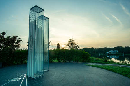 Cos Cob, CT / USA - 8/9/20: a horizontal sunrise image of the September 11 Memorial at Cos Cob Park, with Cos Cob Harbor in the distance.のeditorial素材