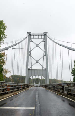 Kingston, NY / United States - Oct.13, 2020: Vertical image of The KingstonâPort Ewen Suspension Bridge also known as the Wurts Street Bridge is a steel suspension bridge spanning Rondout Creek.のeditorial素材