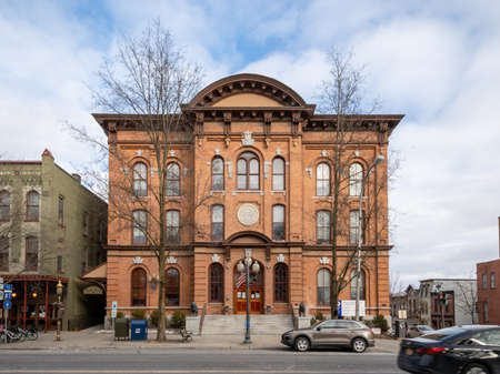 Saratoga Springs, NY - USA - Mar. 6, 2021: A landscape view of the Saratoga Springs City Hall, an ornate three-story brick Italianate building built in 1871 by Cummings and Burt of Troy.のeditorial素材
