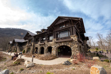 Bear Mountain, NY - USA - Mar. 27, 2021: View of the Bear Mountain Inn, an early example of the rustic lodge style influenced by the Adirondack Great Campsのeditorial素材