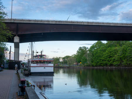 Kingston, NY - USA- May 12, 2021: a landscape view of the Rip Van Winkle II, a tour boat docked on Rondout creek on Kingstons waterfront.のeditorial素材