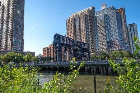 Long Island City, NY - USA- June 13, 2021: A view of Gantry Plaza State Park, with transfer bridges, support gantries, and piers. on the East River in the Hunters Point section of Long Island City.のeditorial素材